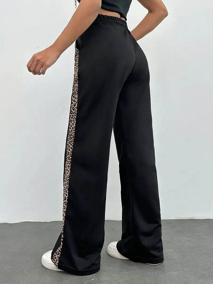 Dynamisk Leopard | Joggingbyxor Dam med Elastisk Midja | Bekväm Design för Aktiv Livsstil 1