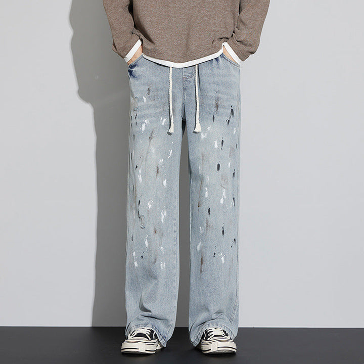 Ethan | Slitna Microelastiska Jeans Herr med Dragsko och Graffiti-design 1